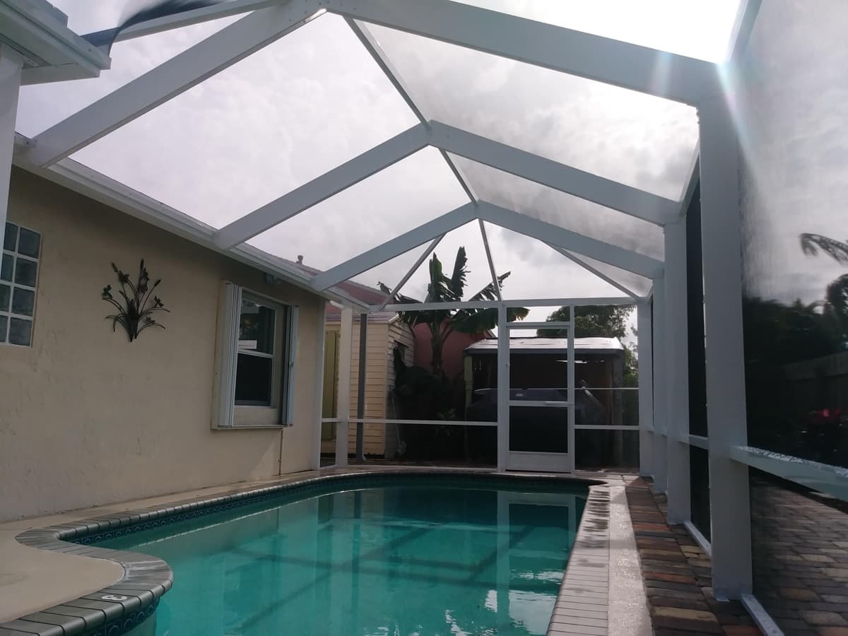 Spacious screened combo room enclosure with pool view in Lake Worth, Florida